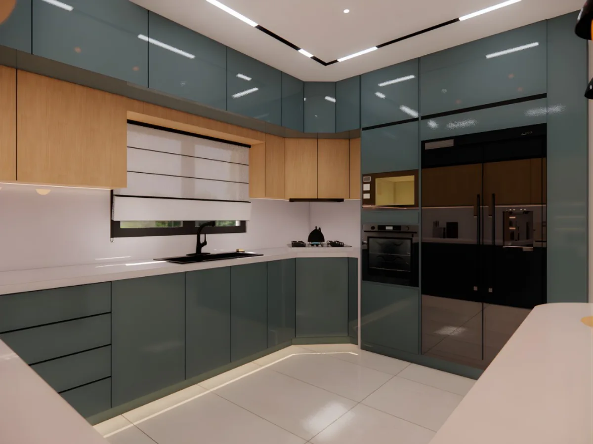 Kabinet dapur letter L finishing glossy warna hijau petrol dengan backsplash putih dan peralatan elektronik tanam (built-in appliances).