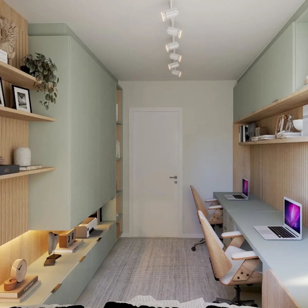 Perspektif memanjang lorong home office dengan dua area meja kerja di sisi kanan dan deretan lemari kabinet hijau sage di sisi kiri.