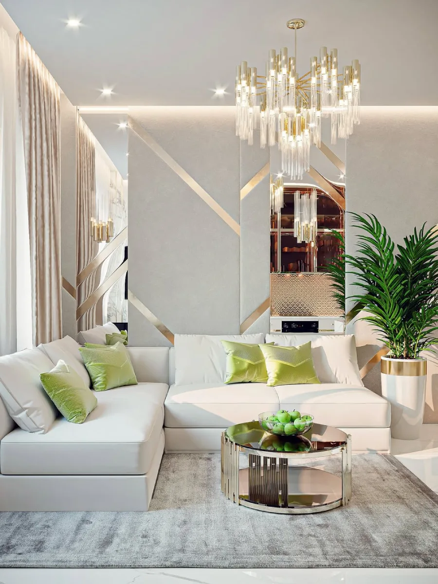 Ruang keluarga berdesain bersih dengan sofa putih, bantal aksen hijau, meja tamu kaca berbingkai emas, dan dinding cermin dekoratif