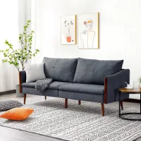 Ruang tamu kecil minimalis dengan sofa abu-abu dan dekorasi sederhana
