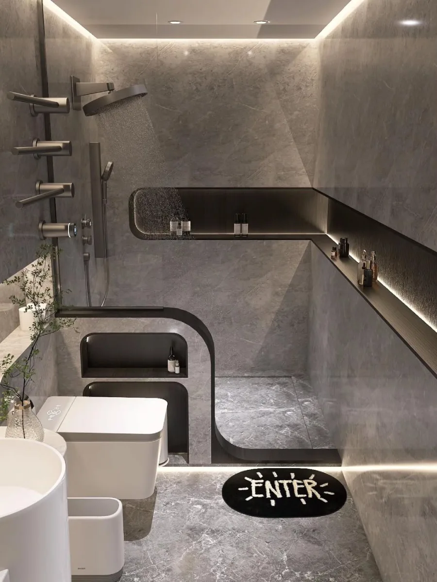 Desain kamar mandi futuristik bernuansa abu-abu batu alam. Terlihat area shower dengan rain shower tanam plafon dan rak dinding cekung dengan pencahayaan LED tersembunyi. Sebuah dinding partisi melengkung berwarna hitam memisahkan area toilet duduk pintar (smart toilet) dari area basah, menciptakan kesan modern dan dinamis.