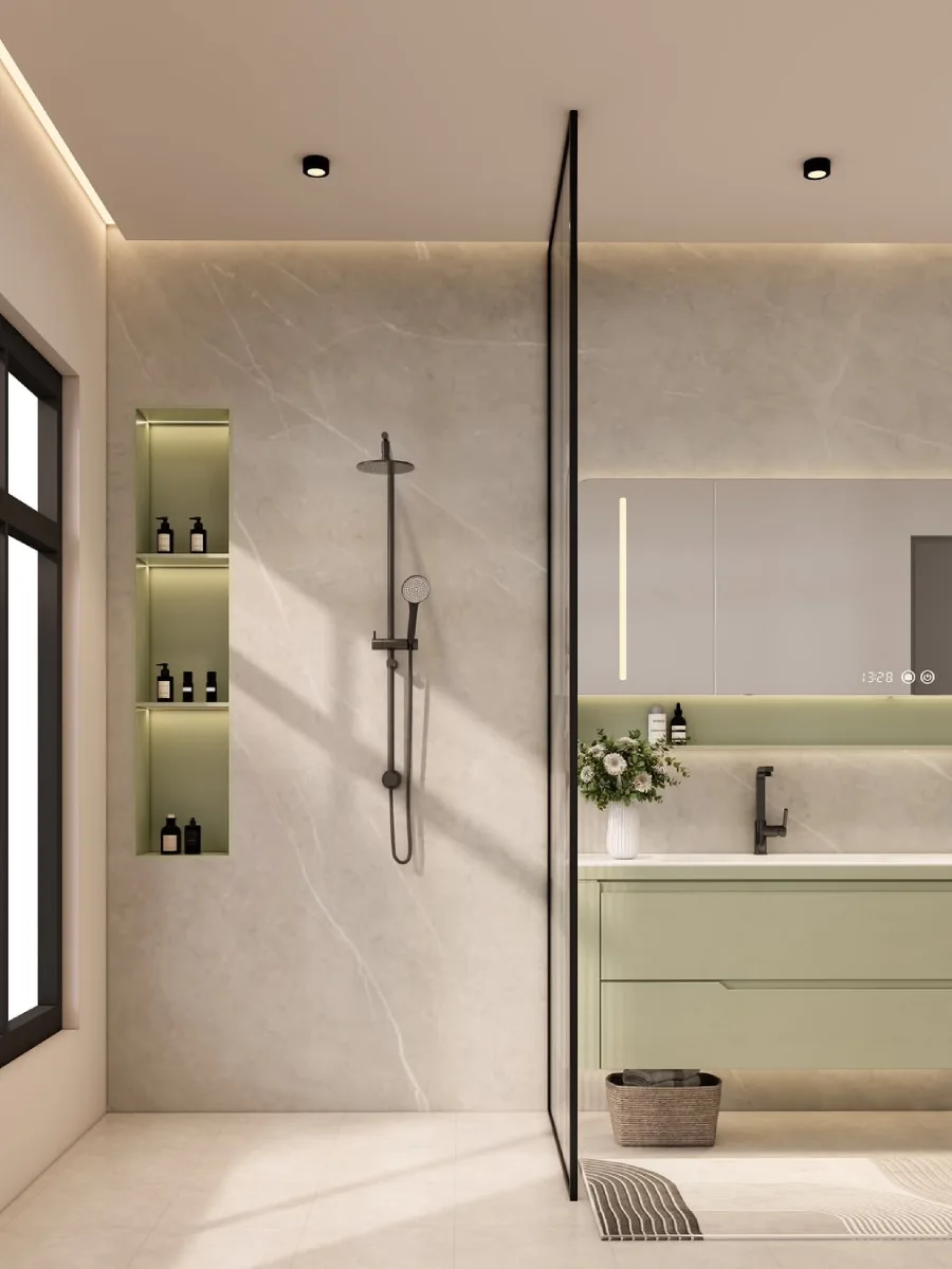Desain kamar mandi minimalis modern dengan kabinet wastafel gantung berwarna hijau sage, cermin pintar persegi panjang dengan jam digital, serta tiang shower hitam matte (black matte) yang kontras dengan dinding marmer krem.