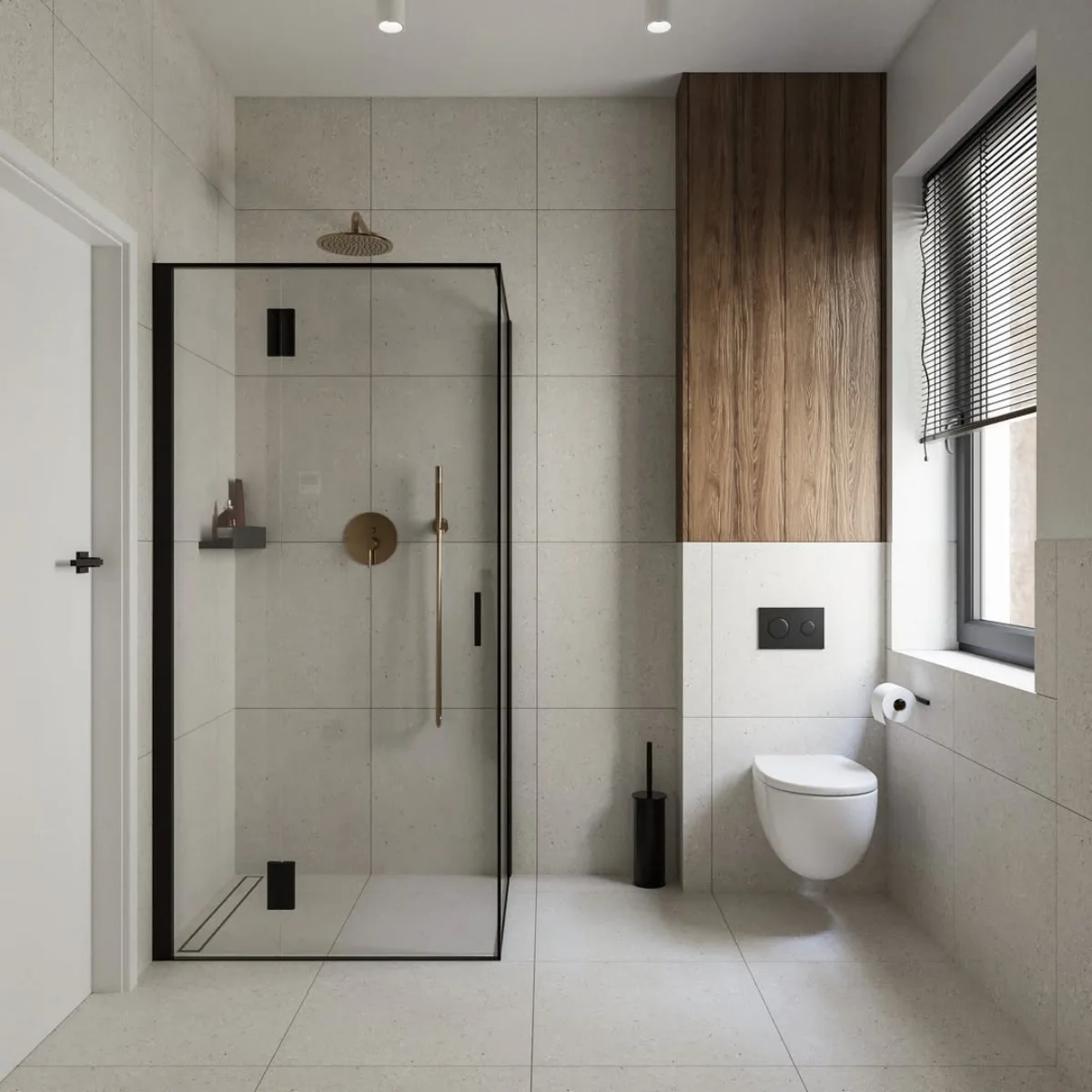 Kabin shower kaca dengan bingkai hitam tegas, lantai bintik-bintik (terrazzo look), dan aksen panel kayu di atas toilet gantung putih.